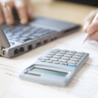 AAT decision on personal deductible contributions woman-using-laptop-and-calculator-close-up_1887093