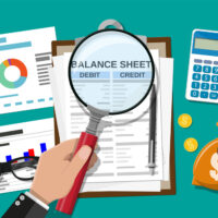 SMSFs and voluntary disclosure to the ATO Clipboard with balance sheet and pen.